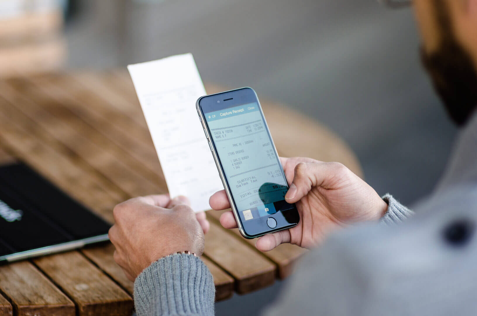 Man using Concur Mobile App to take picture of receipt