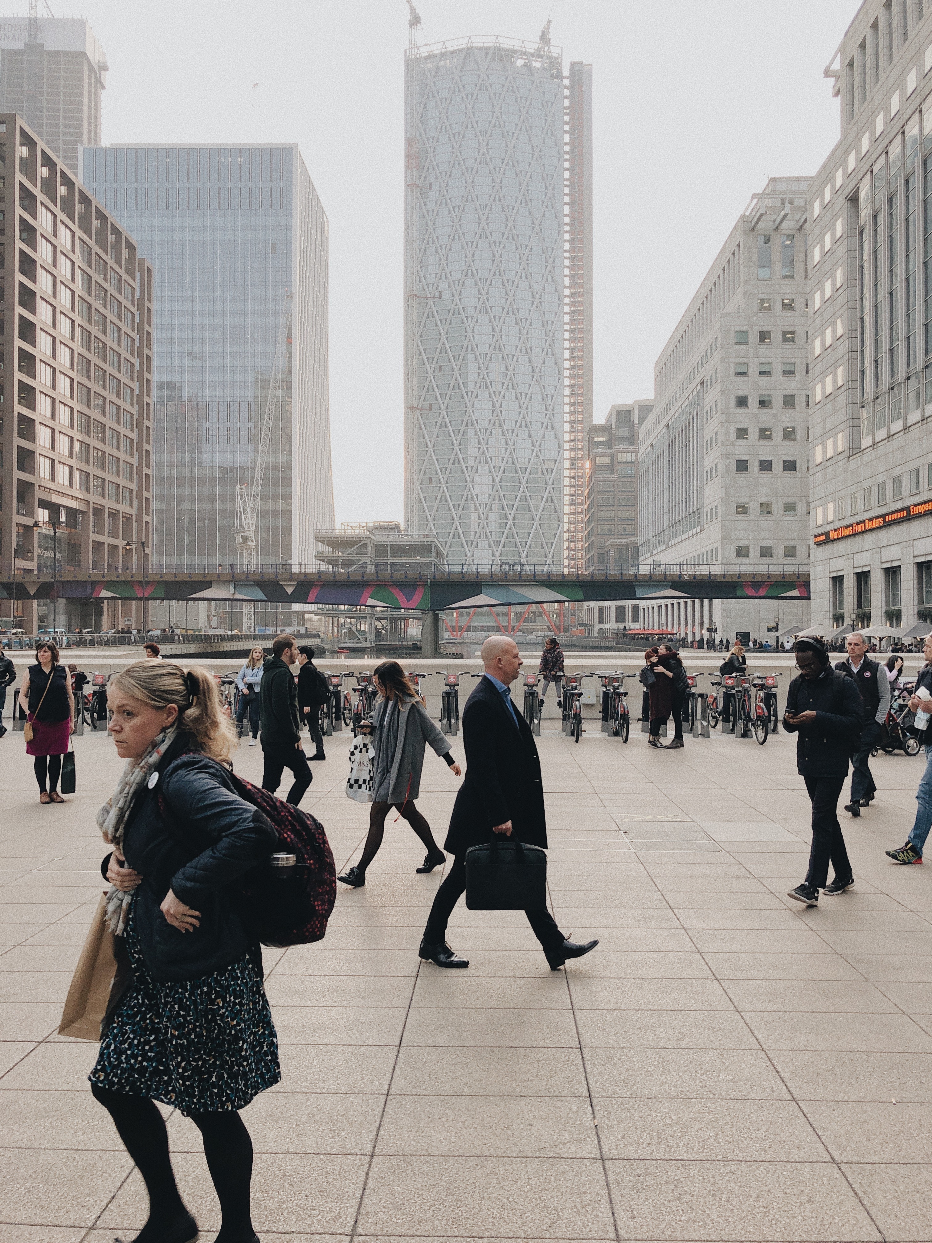 People walking in front of big buildings